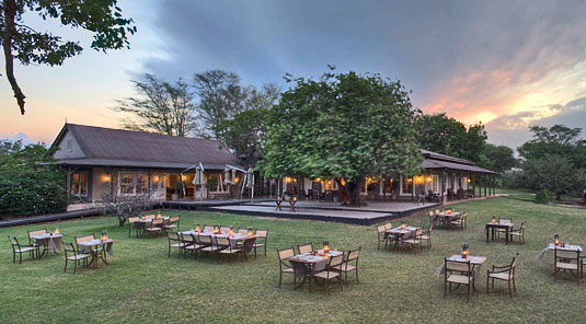 Dining on the lawn at Kirkman's Kamp Main Lodge, Kirkman's Kamp is located in the big 5 Sabi Sand Private Game Reserve in South Africa