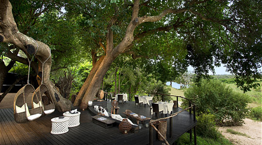 Dine and relax on Lion Sand's Ivory Lodge Main Deck area in the Sabi Sand Private Game Reserve, South Africa
