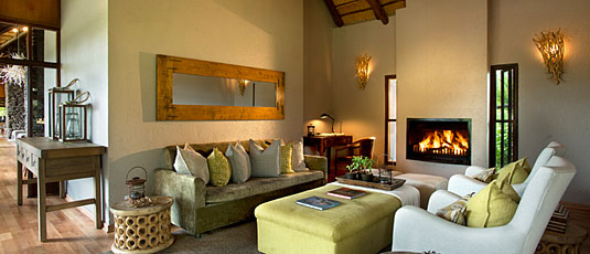 Library with fireplace at Lion Sands Narina Lodge in the Big 5 Sabi Sand Private Game Reserve, South Africa