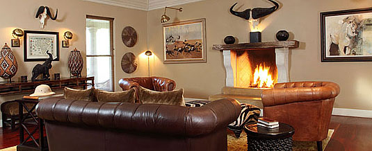 Main Lodge's Lounge with Fireplace at The Rattray's on Mala Mala Camp, Sabi Sand Private Game Reserve Main Lodge Lounge Fireplace The Rattrays on Mala Mala Camp Mala Mala Private Game Reserve Sabi Sand Private Game Reserve Accommodation Booking